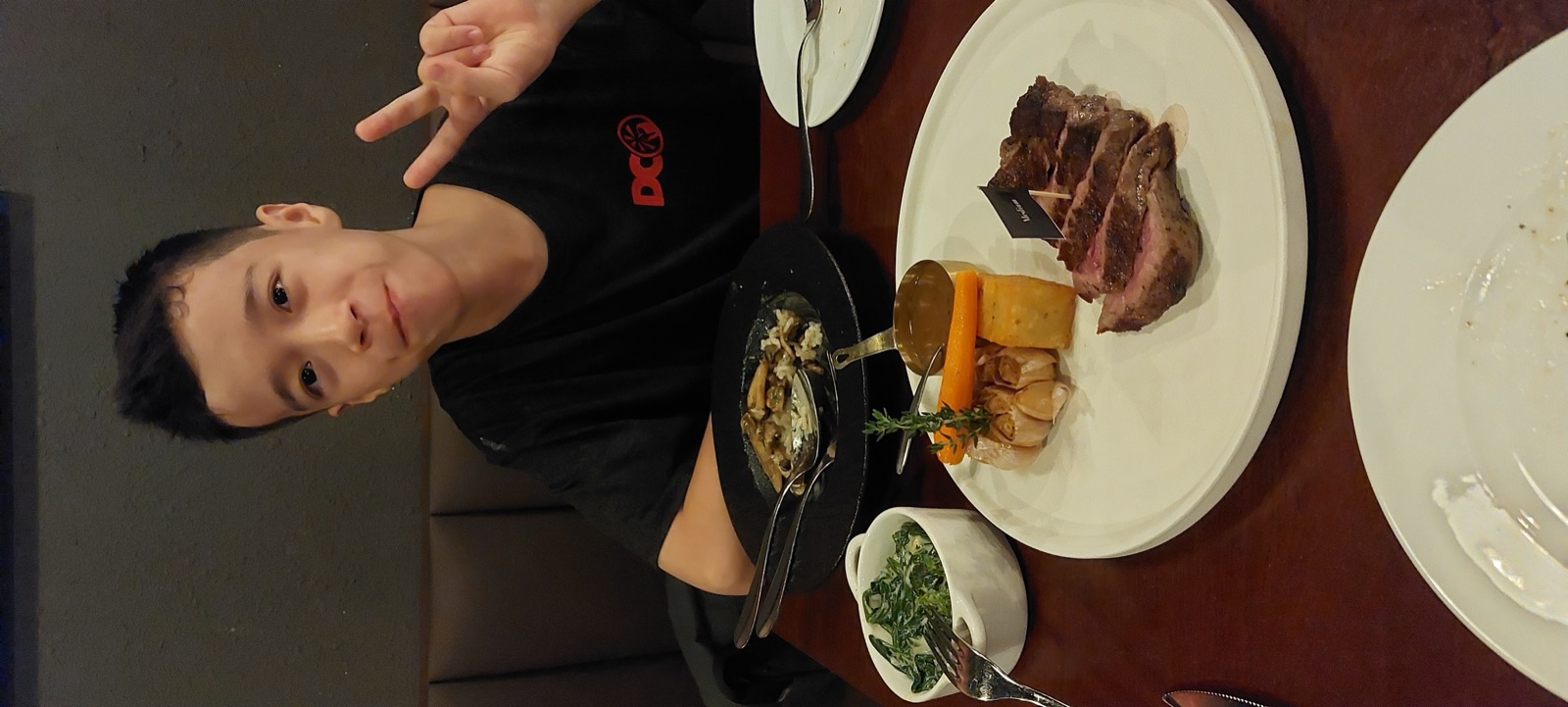 Mike and Miles at a steak dinner in Vietnam