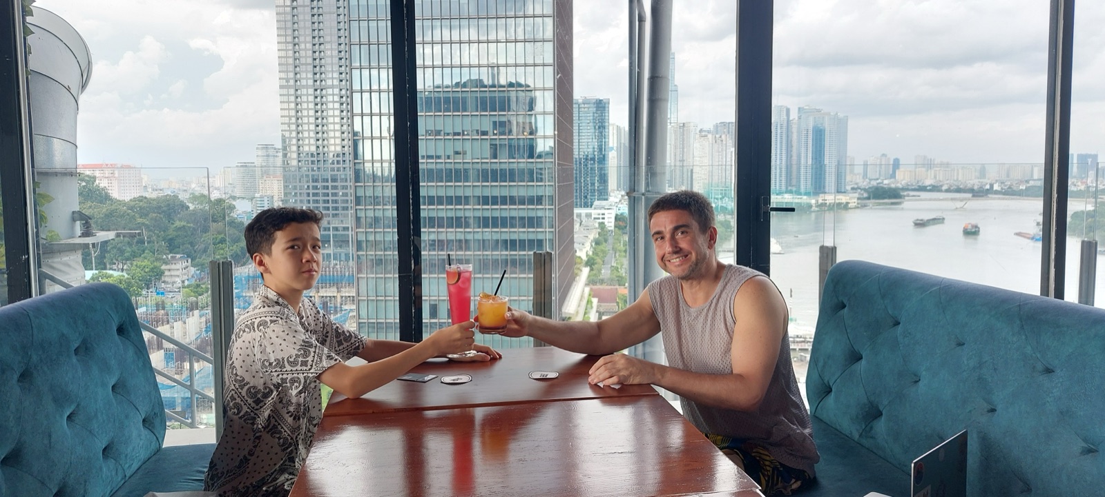 Mike and Miles having a drink on a rooftop in Vietnam