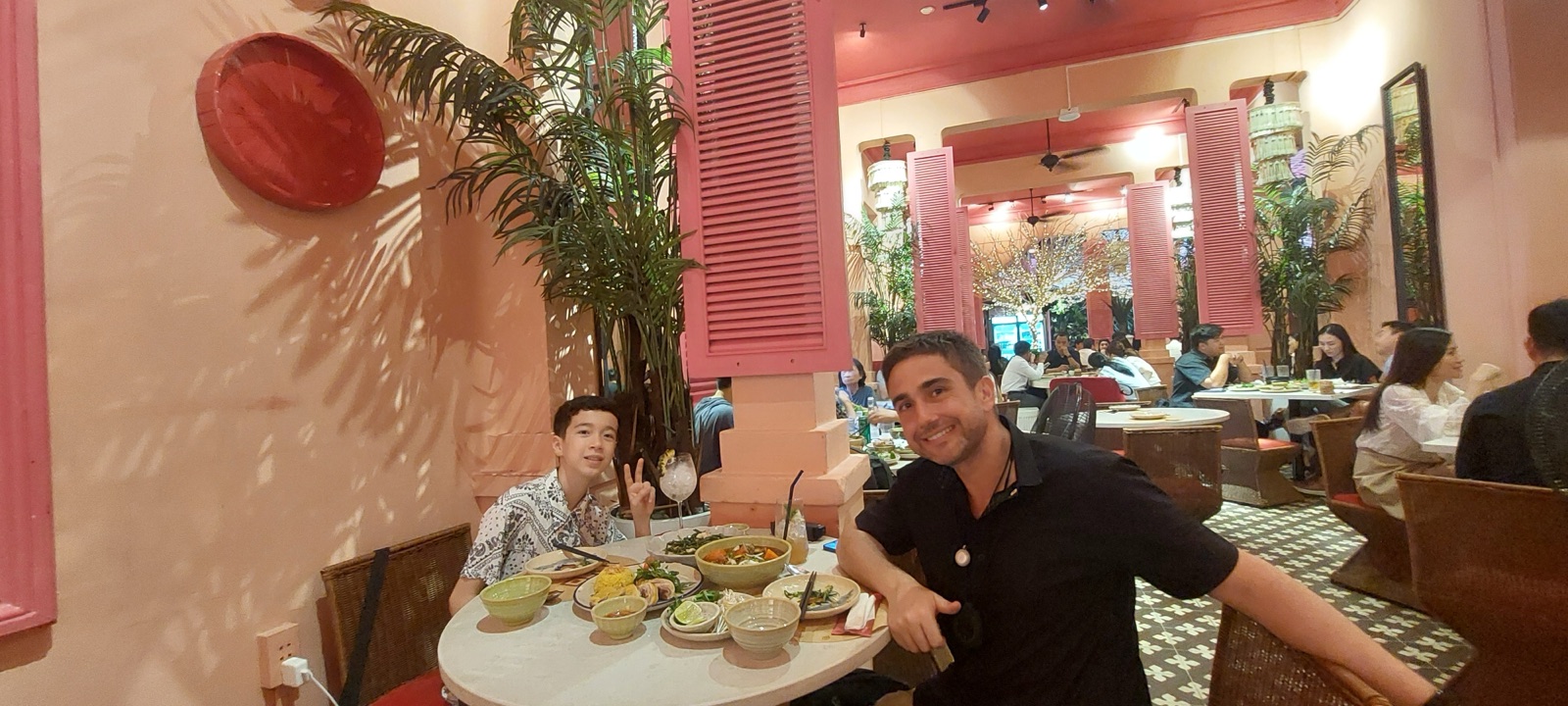 Mike and Miles eating local food at lunch in Vietnam
